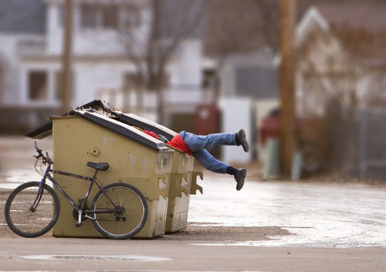 dumpster diving shutterstock 2592381